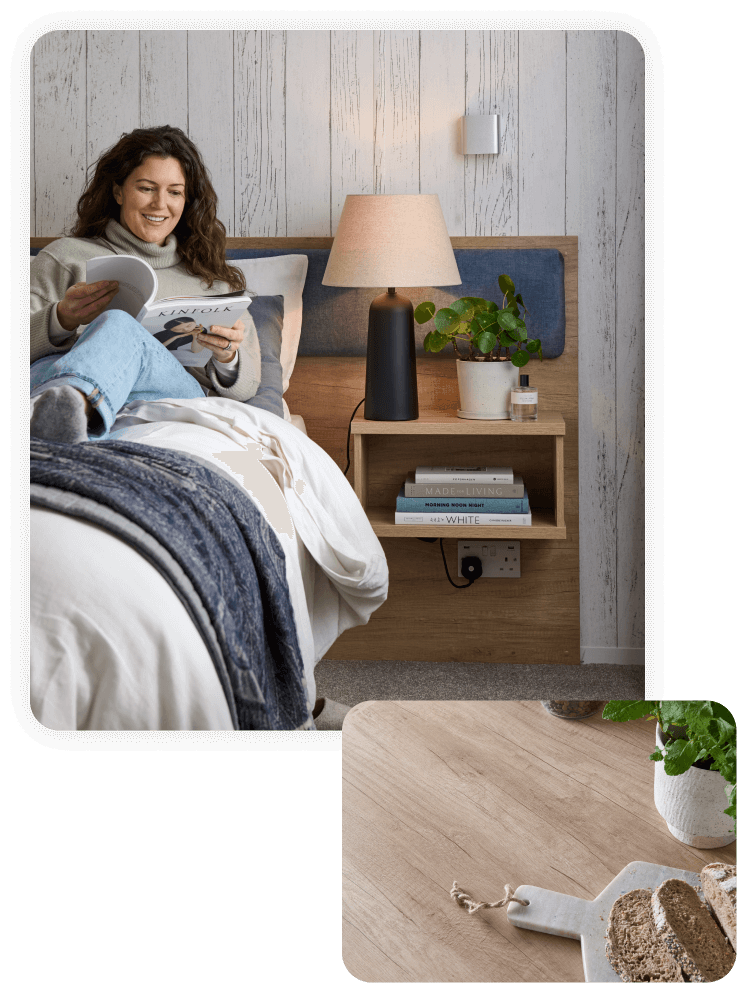 Woman drinking coffee in bed looking through a Don Amott catalog of mobile homes.